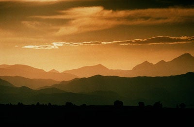 Mountain landscape with clouds and orange sky