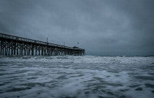 brown wooden dock in storm