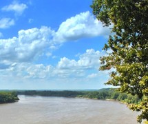 Brown river with blue sky