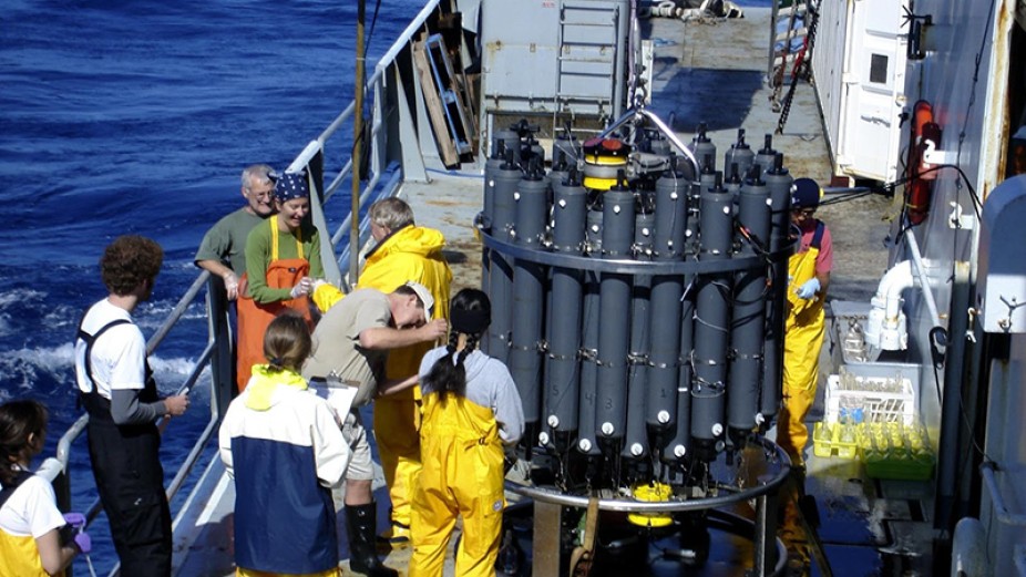 Crew on deck with seawater collection bottles