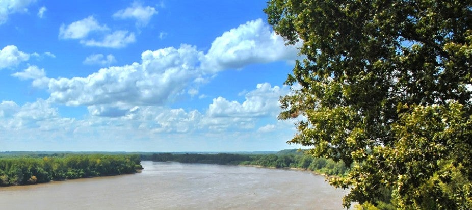 Brown river with blue sky