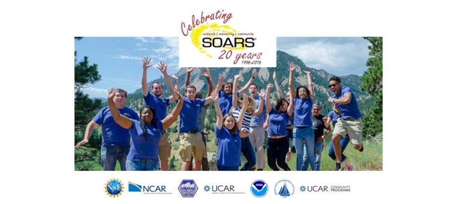 Group of kids jumping with Boulder flatirons in background