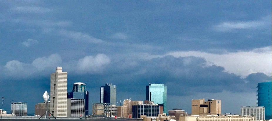 city skyline with cloudy sky