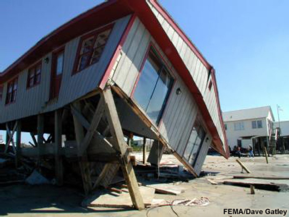 elevated house damaged by storm surge