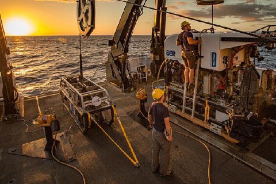 onboard the Okeanos Explorer ship in ocean at sunset