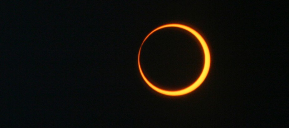 the moon passing in front of the Sun as seen from Earth