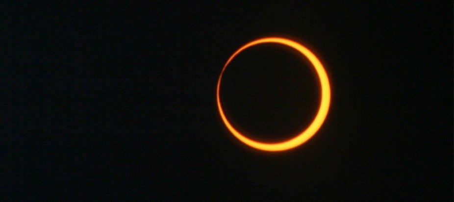 the moon passing in front of the Sun as seen from Earth