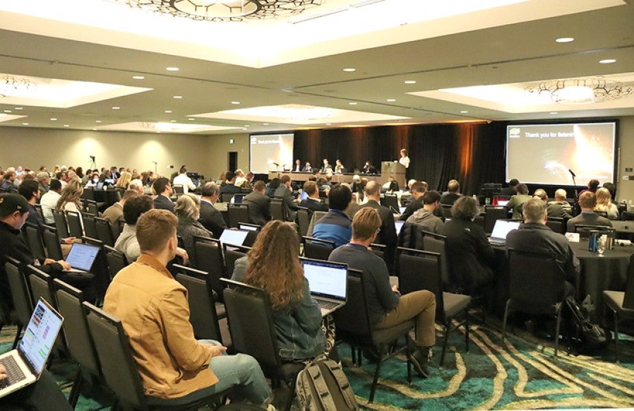 Space Weather Workshop audience listening to a plenary talk.