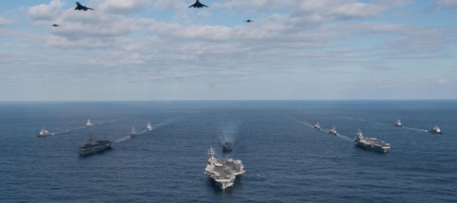 Ocean with ships heading toward the horizon