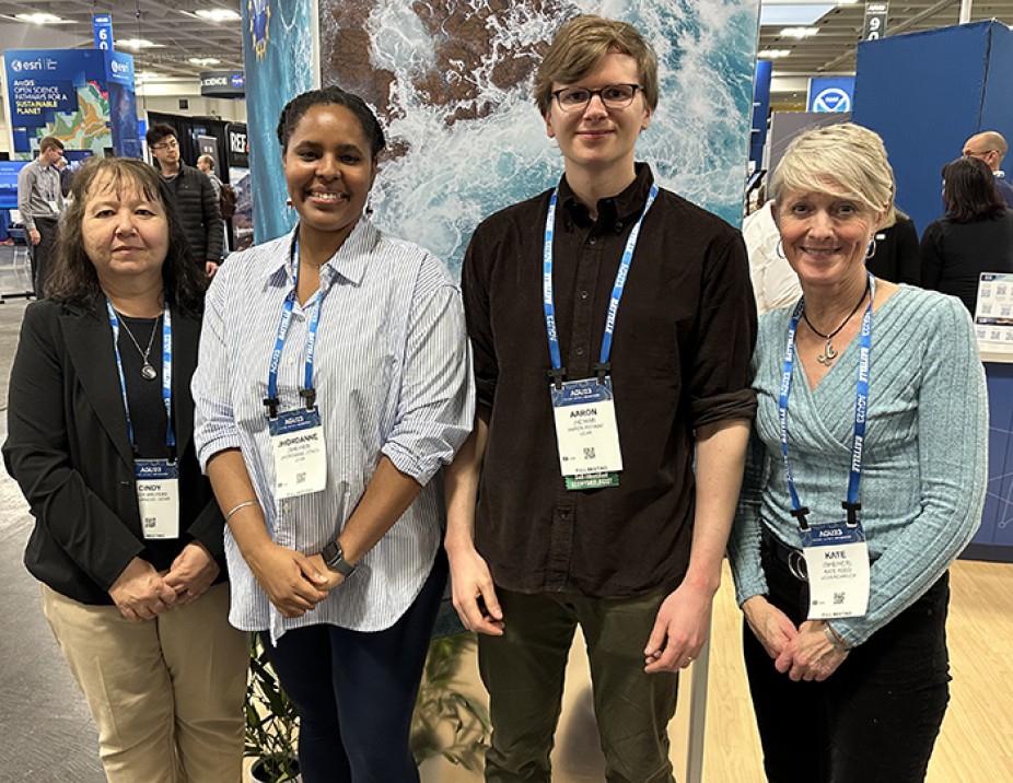 CPAESS Deputy Director Cindy Bruyère, NOAA Climate and Global Change Fellows Jhordanne Jones and Aaron Potkay, and CPAESS Program Specialist Kate Rodd at the UCAR NCAR Booth.