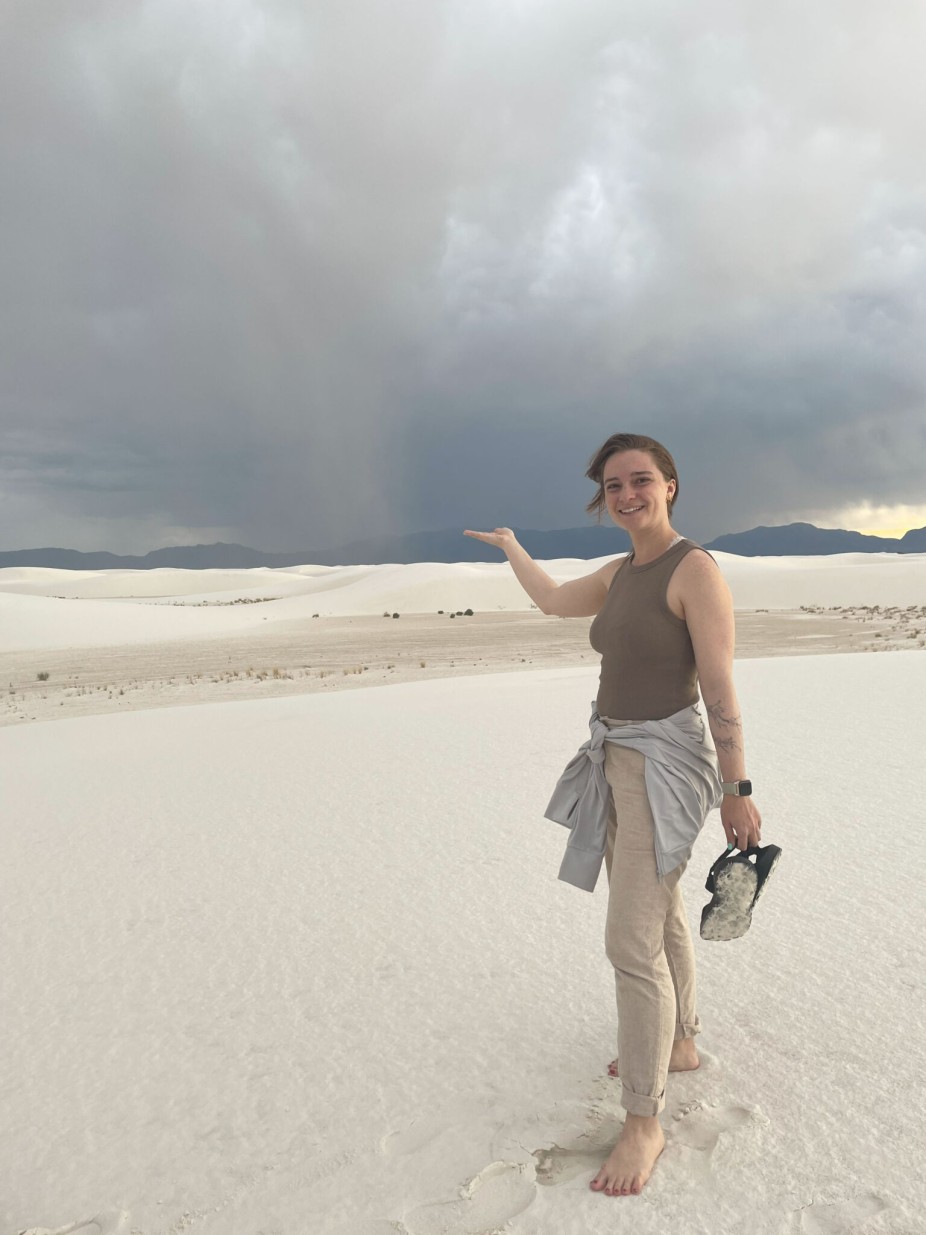 woman standing on sand dunes