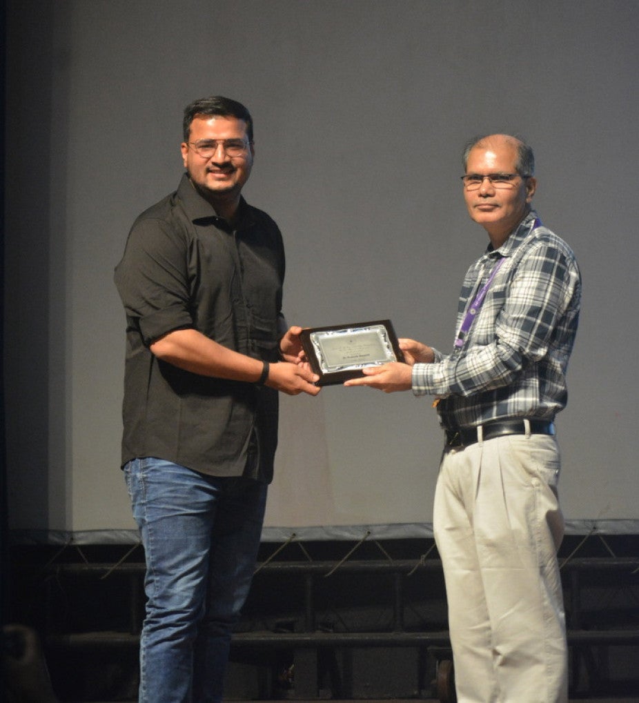 man accepting an award