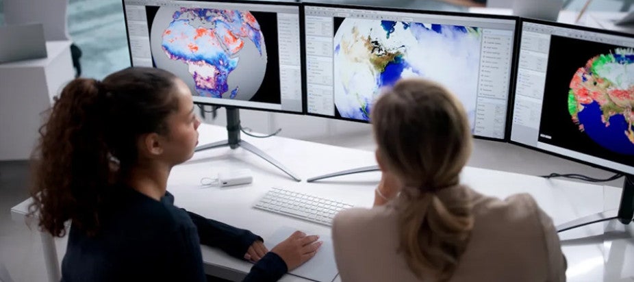 2 women sitting at computers