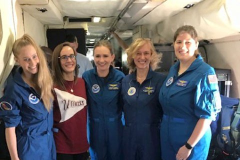 Five women scientists inside research airplane