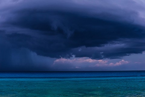 stormy dark blue clouds over the ocean